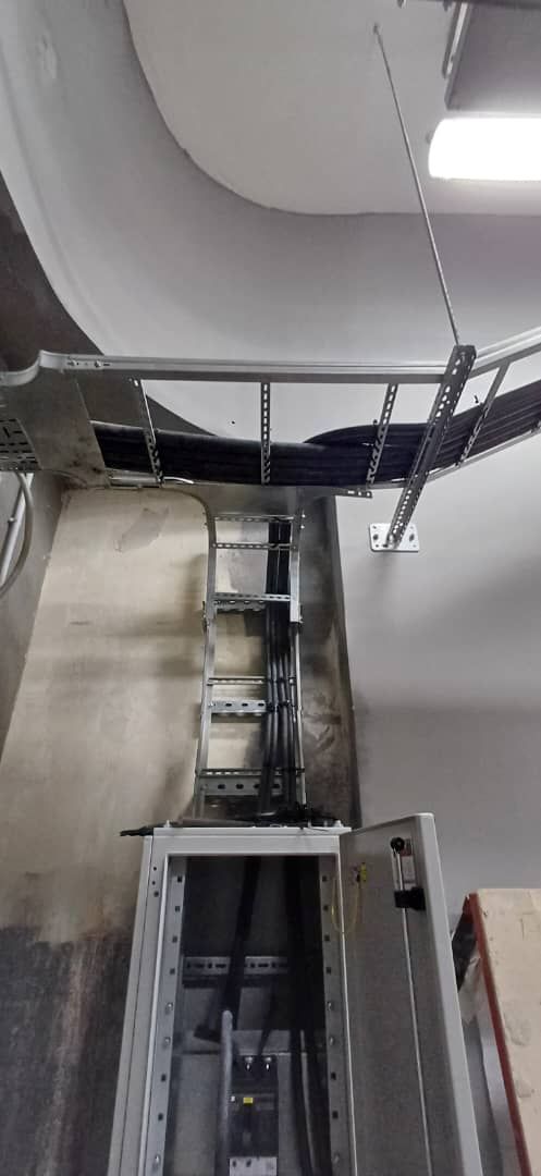 A cable ladder rising to a switchboard